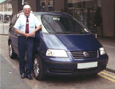 Iain Macdonald with his Volkswagen Sharan. 1 - 6 Passengers